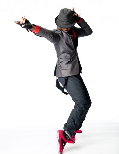 Male hip hop dancer standing on tip toes