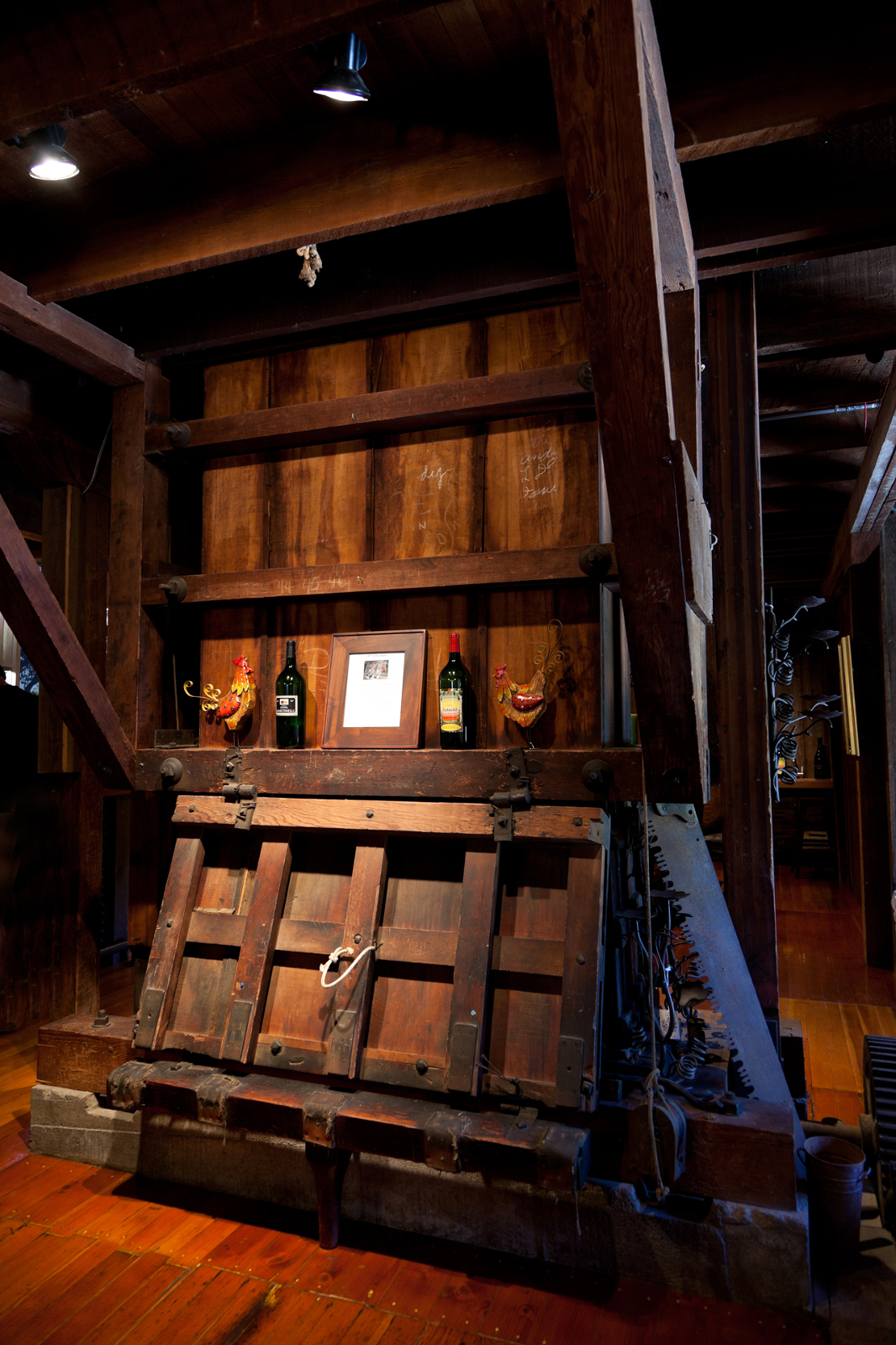 Antique wine wood distiller indoors at winery